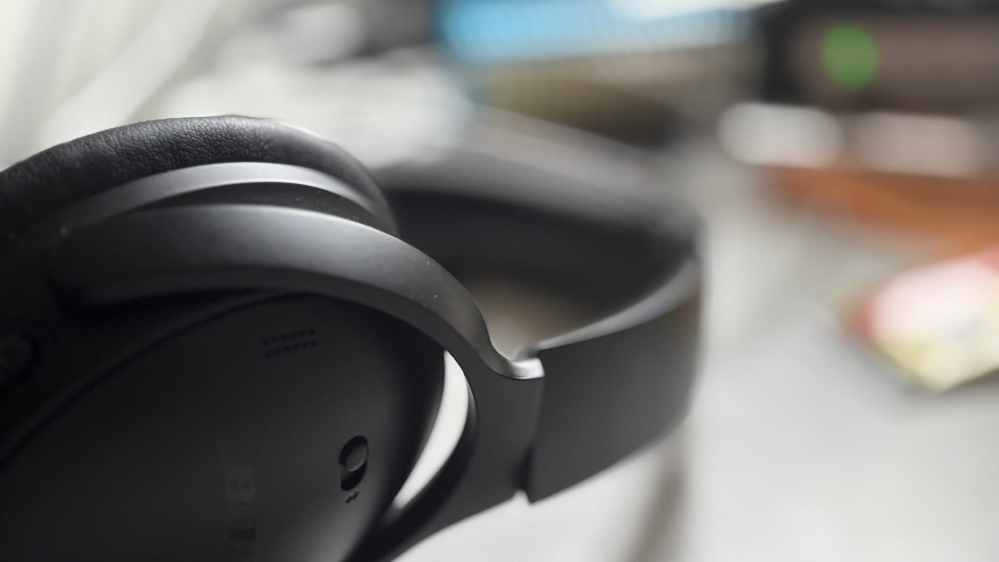 Headphones on a desk in soft light